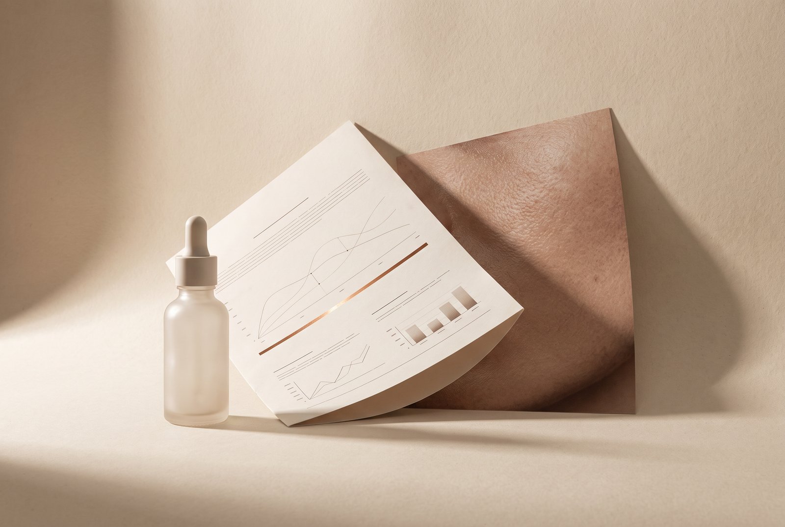 An Aliquot serum bottle beside a printed Vernier reading and a macro print of skin.